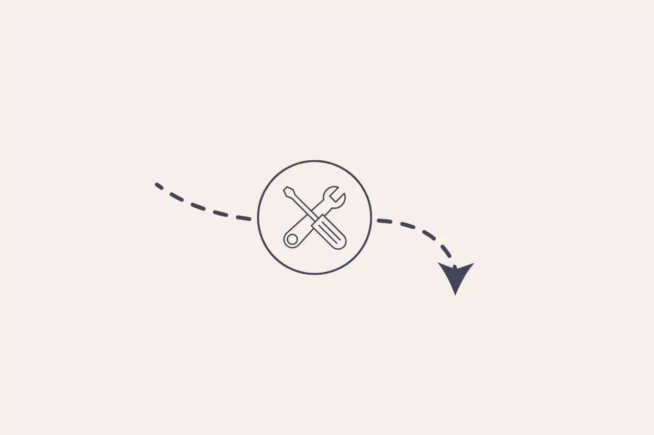 Une icône circulaire avec une clé et un tournevis entrecroisés, accompagnée d'une flèche pointillée descendant vers la droite.