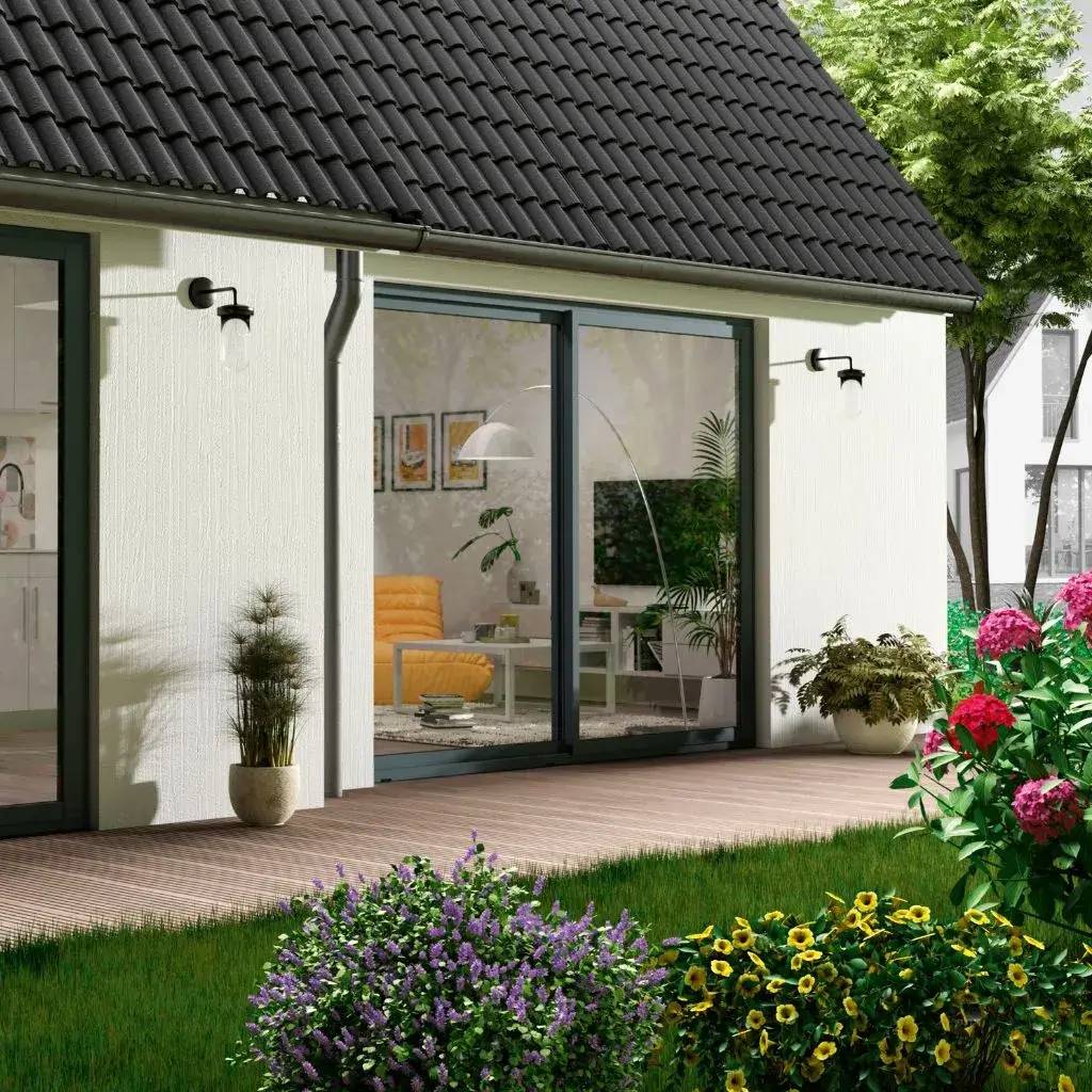 Une façade moderne avec de grandes baies vitrées donnant sur un jardin fleuri et une terrasse en bois.
