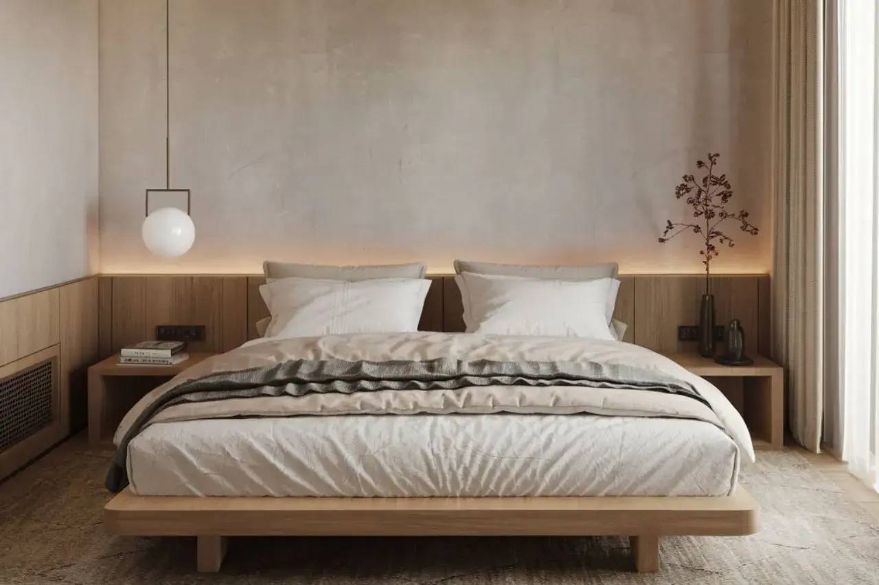 Chambre minimaliste avec un lit double en bois, éclairage doux et décoration épurée.